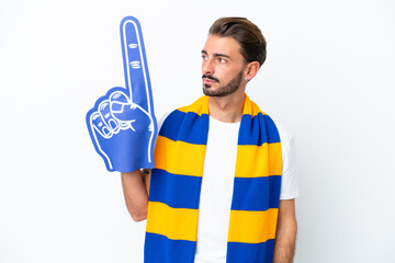 Young sports fan man isolated on white background looking to the side