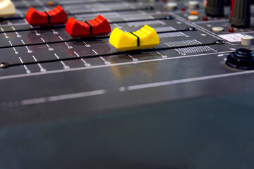 Slide volume mixer in a professional recording studio.