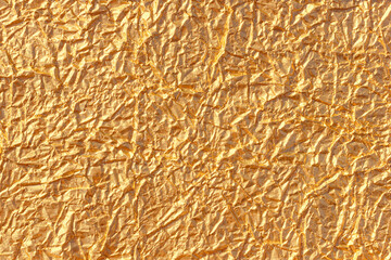 Golden foil background. Abstract wrinkled texture pattern. Metallic wrap paper texture or backdrop. - 670001910