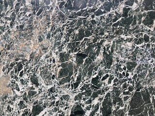 fondo abstracto de la textura de un mármol negro con betas blancas