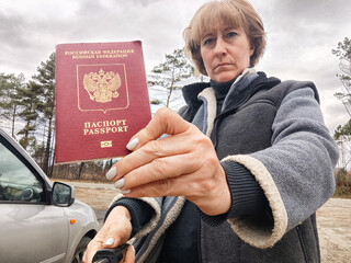 Driver girl with a Russian passport and car. Russian cars banned for entering in Europe. Russian...