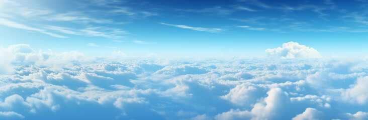 Fototapeta na wymiar Blue sky background with tiny clouds. Panoramic view. Beautiful aerial view above clouds with blue sky. Beautiful aerial view above clouds on a sunny day.