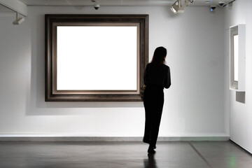 Audiences looking at oil paintings in gallery