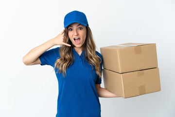 Young Romanian delivery woman isolates on white background making phone gesture. Call me back sign