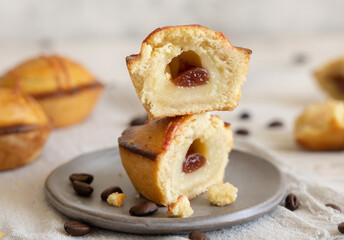 Pasticciotto leccese pastry filled with egg custard cream and sour cherry jam on a plate