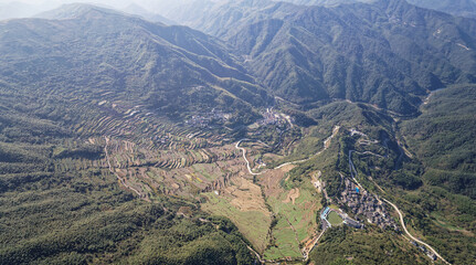 Drone flight above authentic rice terraces near Fuzhi mountain Dongcheng village at Shaoxin, Zhejiang provnice, China. High angle view of rice terrace fields in mountains.