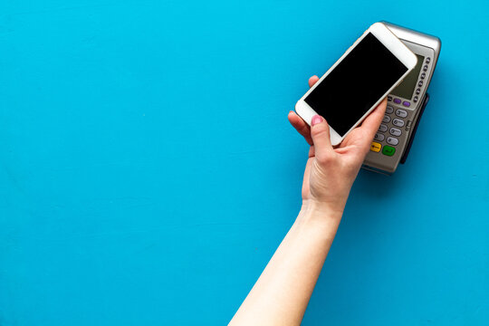POS payment terminal reader with mobile phone. Online banking concept