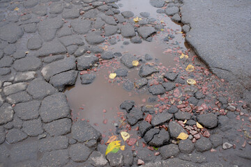 Damaged asphalt road surface