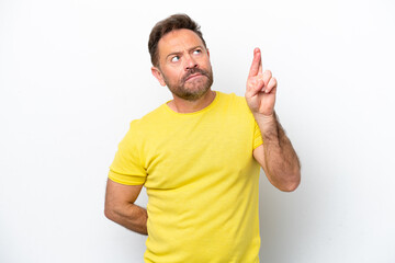 Middle age caucasian man isolated on white background with fingers crossing and wishing the best