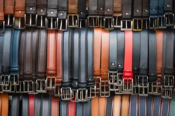 Keuken spatwand met foto many leather belts on the market © ksena32