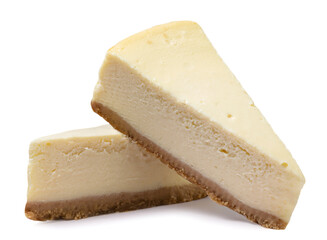 Two pieces of cheesecake close-up on a white background.