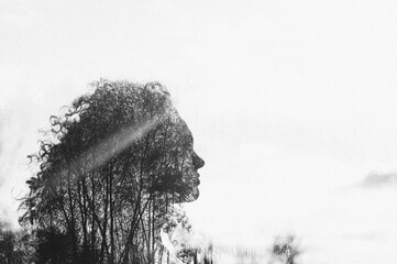 Silhouette of woman with trees