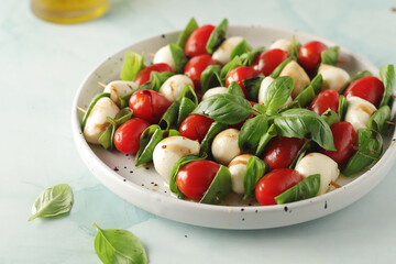 A plate with Italian salad caprese canape