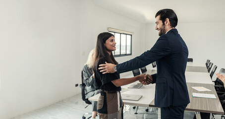 Business people shaking hands after success meeting in office,Businessman smile and shack hand with...