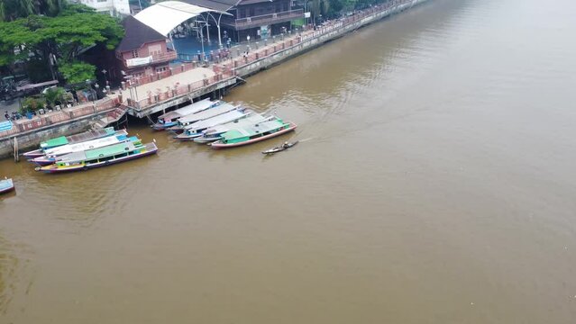 Rental boat parked on the river in the Siring area of Banjarmasin as transportation for river trips