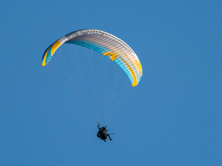 paragliding in the blue sky