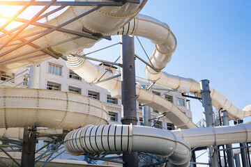 Water park with tall white water slides.
