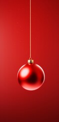 A red ornament hanging on a vibrant red background