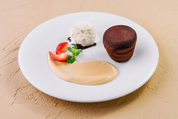 White plate with chocolate fondant cake