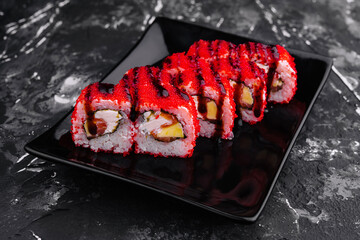Sushi Roll California on black stone plate