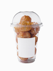 profiteroles or cream puff in plastic bowl