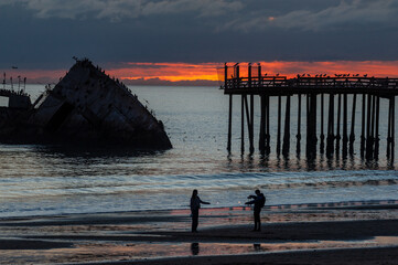 Silhoutte of the SS Palo Alto, an old World War II shipwreck, around sunset off the coast of Aptos,...