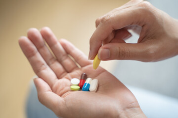 Healthcare Harmony: Close-Up Hands Holding Medication and Water Glass for Optimal Wellness, Pharmaceutical Treatment and mental health treatment