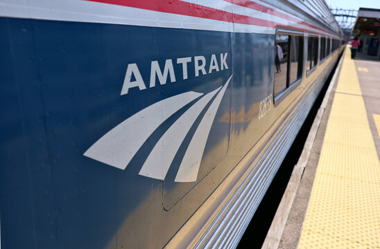 Amtrak logo on the side of a train stopped at a station in connecticut. Vermonter trains switch engines from electric to diesel at the New Haven stop. 