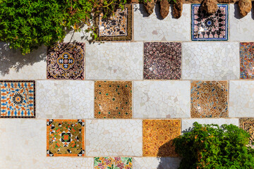 Mosaic wall by Antoni Gaudi in the Park Guell in Barcelona, Catalonia, Spain