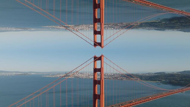 Aerial view of famous red bridge over bay. Traffic on Golden Gate bridge, San Francisco, USA. Abstract computer effect digital composed footage