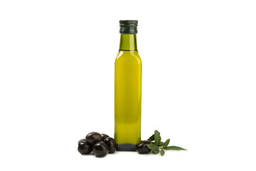 Olive oil in a bottle isolated on white background. Oil bottle with branches and fruits of olives.  cooking oil and salad dressing.