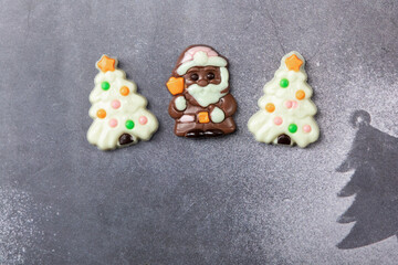 Christmas chocolates. Chocolate Christmas trees and Santa Claus.