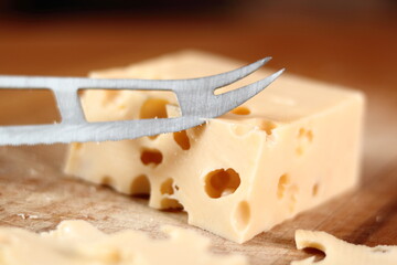 Holey cheese and knife