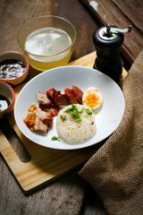 Duck and Crispy Pork over Rice with Sweet Gravy Sauce