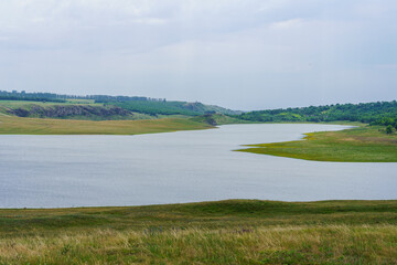 Fototapeta premium Calm river. Background with selective focus and copy space