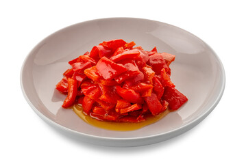 Cooked chopped red peppers seasoned with olive oil  - peperonata in white plate isolated