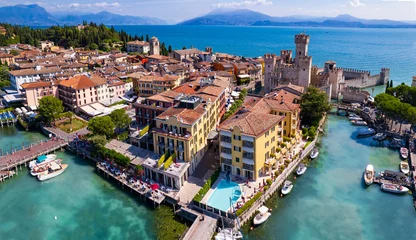 Gordijnen Scenic lake Lago di Garda aerial drone view of Sirmione town and medieval castle Scaligero. Italy, Lombardy. © Freesurf