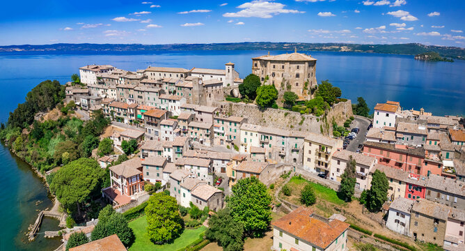 Scenic lakes of Italy - beautiful lago di Bolsena. aerial view of Capodimonte medieval authentic village and castle. Viterbo province, Lazio region.