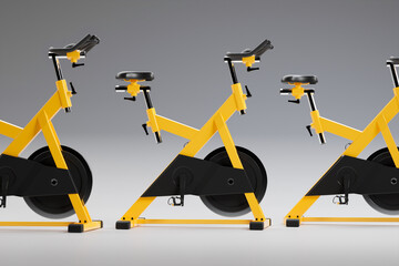 Fitness bicycles or spinning bikes in the modern gym. Cardio, health, wellness