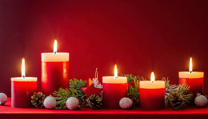Burning candle with christmas decoration and red background