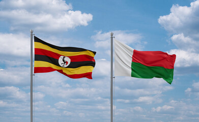 Madagascar and Uganda flags, country relationship concept