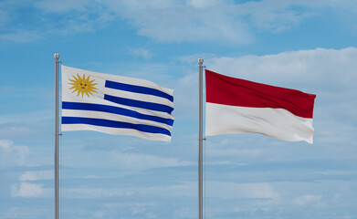 Indonesia and Uruguay flags, country relationship concept