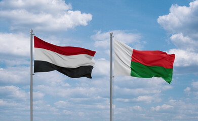 Madagascar and Yemen flags, country relationship concept