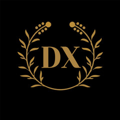 DX letter branding logo design with a leaf