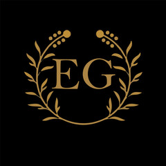 EG letter branding logo design with a leaf