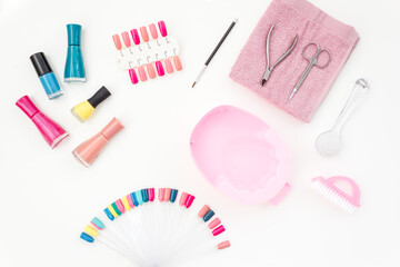 Bright gel varnishes with manicure and pedicure beauty tools, top view