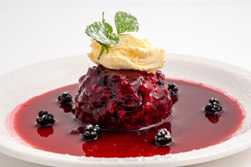 Red berries, summer pudding with vanilla ice cream