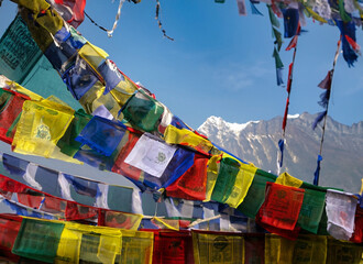 Prayer flags in Nepal with temple
