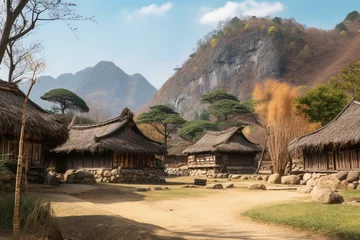 Fotobehang Korean village, thatched roofs, mountain backdrop. Generative AI © Zada