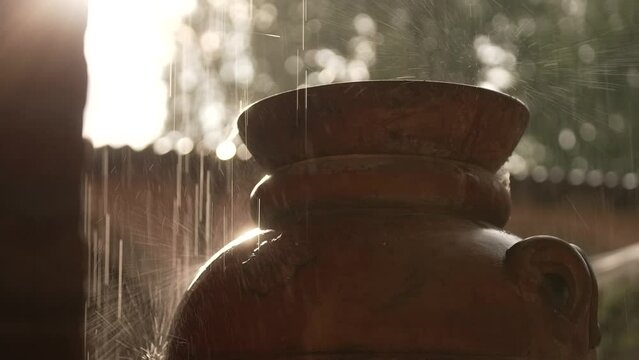 rain on a brown Roman amphora
